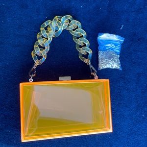 Acrylic clear orange purse handbag with long chain & short handle